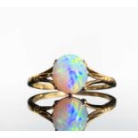 An 18ct gold opal set ring with elegant fleur-de-lis setting 1.8gmCondition report: Size LVery