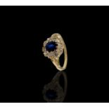 A late Victorian or Edwardian 18ct gold sapphire and diamond oval cluster ring 2.3gm