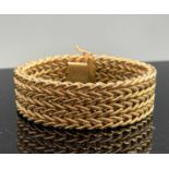 A 9ct gold mesh bracelet width 19mm 35.4gmCondition report: Length 19cm, clasp in good order, no