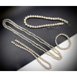 Cultured pearls - three necklaces and a braceletone continuous strand 122xmone chunky string of