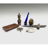 A Navagas lock knife, a carved Rajasthan bottle stopper, cigar cutter, tigers eye egg, etc.