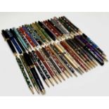 A large collection of fountain and ballpoint pens, including cloisonne