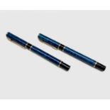 A Waterman Laureat blue fountain pen and matching rollerball pen