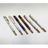 Six fountain pens, each has a German Iridium Point nib, gold plated mounts and a variety of tubes in