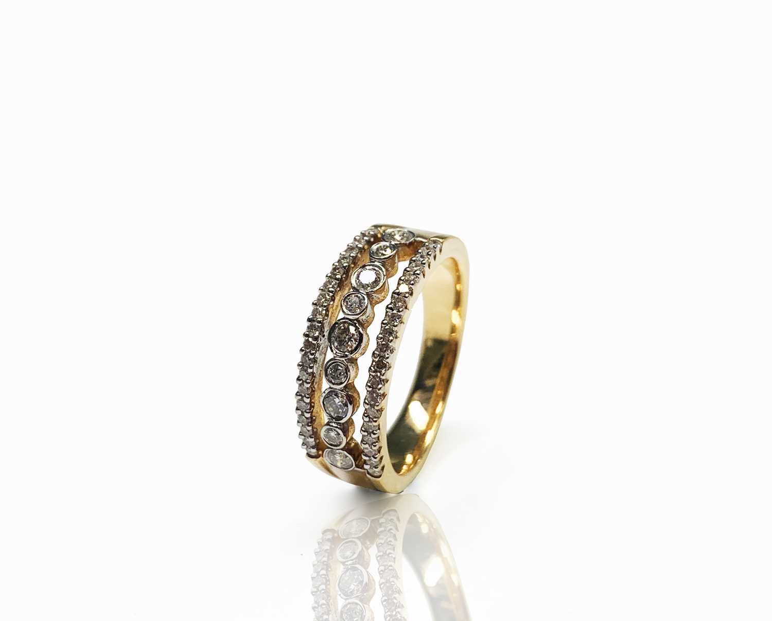 A 14ct gold three row diamond ring 6.3gmCondition report: Approx size M-N