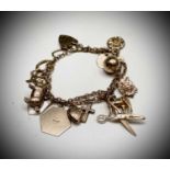 A 9ct gold charm bracelet 24.3gm