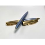 A Parker 100 Diamond Blue fountain pen date code L and a matching ball pen code L