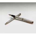 A Waterman L'Etalon Sterling silver and gold plated basket weave fountain pen with 18ct gold nib and
