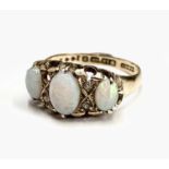 A Victorian 18ct gold ring set with three graduated opals and three (of four) diamonds, Birmingham