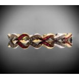 An 18ct yellow and white gold ruby and diamond bracelet 18.6gm 18cmCondition report: No missing