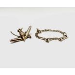 A 9ct gold kookaburra and boomerang brooch and a 9ct gold bracelet 8.8gm