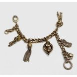 A silver gilt curb link bracelet with three tassels, a miniature locket, etc. 33.4gm Please note