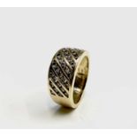 An 18ct gold ring set with diagonal bands of small diamonds 8.3gm