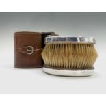A pair of silver-mounted gentleman's brushes in leather case, Birmingham 1918