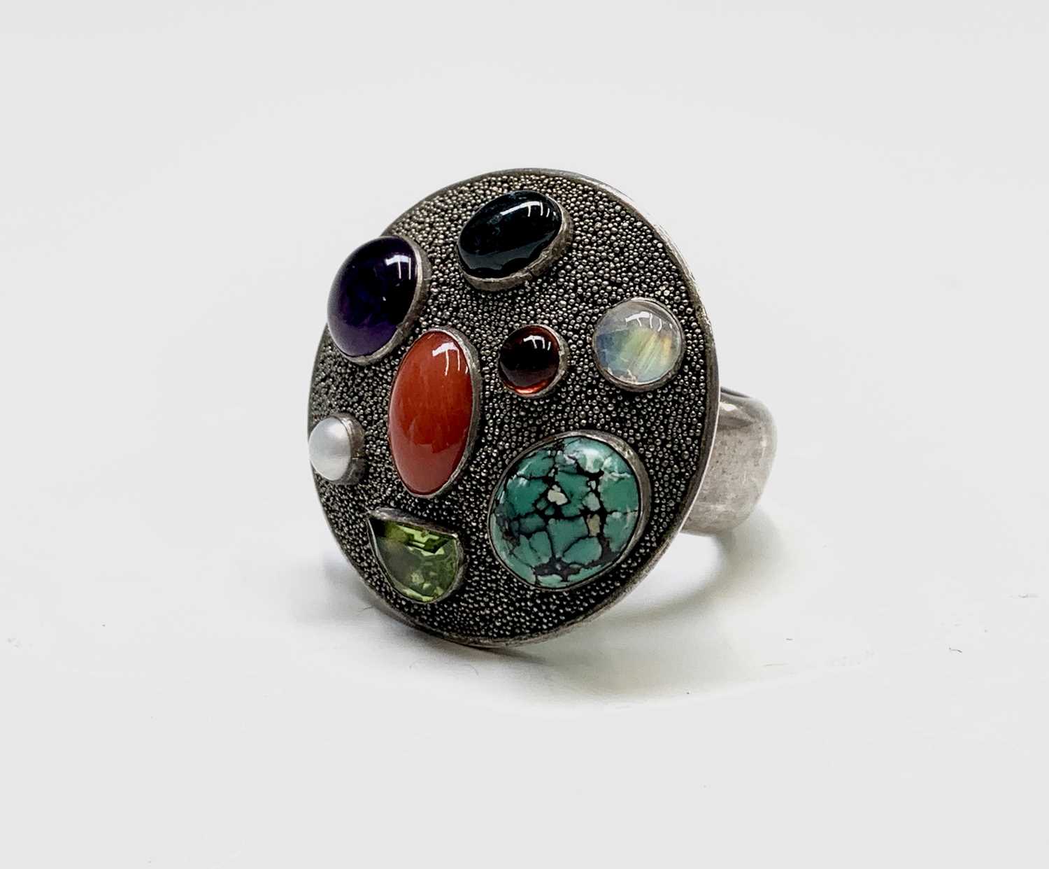 Silver ring, the round table-top surface set with various semi-precious stones. - Image 2 of 3