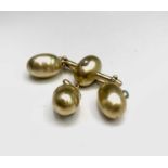 An eccentric Victorian high purity gold mourning brooch with four egg drops, two set with pearls and