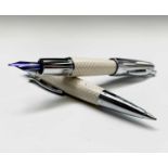 A Fabre Castell fountain pen in cream brick pattern with matching ballpoint