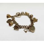 A 9ct gold charm bracelet 29.9gm