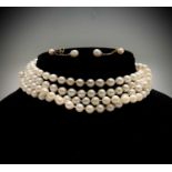 A cultured pearl necklace, 132cm, with a pretty 14ct flower clasp set a pearl,together with a pair