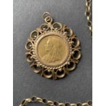 A gold sovereign, 1895, set in a large 9ct mount (13.2gm) On a 9ct gold belcher chain, 7.4gm