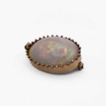 A gold-mounted opal pendant/brooch 35mm 13.9gm