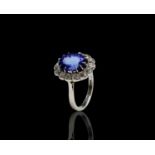 A fine platinum, tanzanite and diamond oval cluster ring. 6.7gm size PCondition report: Ring size P,