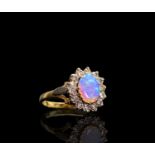 An opal and diamond oval cluster ring 3.7gmCondition report: The condition of the stone and band