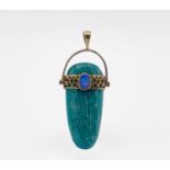 An Egyptian revival style pendant in amazonite, shaped as a stone axe head, it is girdled with a
