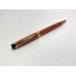 A Waterman Liason orange Ebonite ball pen