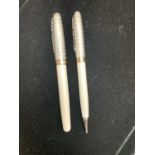 A Parker Sonnet pearl and silver fountain pen with 18ct gold medium nib empty cartridge and matching