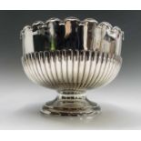 An impressive pedestal punch bowl, the interior gilt, with scalloped rim and half fluted body by