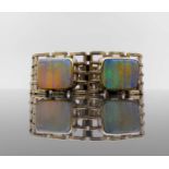 A 9ct gold five-bar gate-link bracelet mounted with two opals 29.4gm