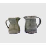 Leach Pottery, St Ives Two jugs with celadon glazeEach with impressed Leach seal Height 11cm and