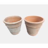 A pair terracotta plant pots of large proportions. Height 60cm, diameter 60cm.Condition report: