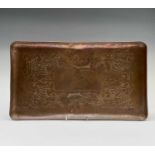 Herbert Dyer, a rectangular Cornish copper tray, decorated with four fish on a planished ground,