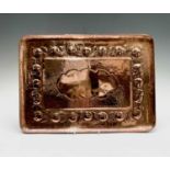 A Newlyn copper rectangular tray, with a large central vacant cartouche and a border repousse