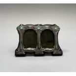 An Art Nouveau style double photograph frame, stamped 'STERLING', height 6.65cm, width 11cm.