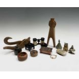 An assortment of curios, to include an Arts and Crafts copper trinket box, two treen nutcrackers,