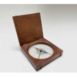 A 19th century mahogany cased travelling or field compass, with a printed paper dial, the blued