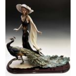A Guiseppe Armani Florence figure, 'Proud and Beautiful', modelled as a lady with a peacock, limited