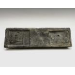 A 19th century Cornish tin ingot from the wreck of the SS Cheerful, with the marks of the