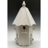 A white painted wood wall mounted dovecote. Height 80cm.