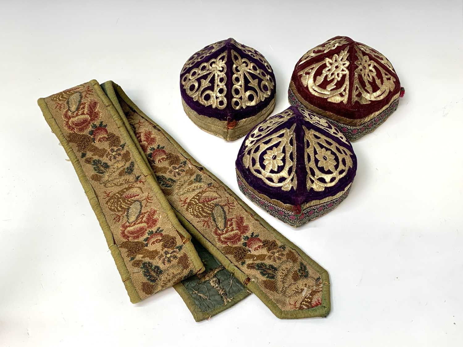 Three eastern skull caps, circa 1920, each embroidered and with gold thread decoration, together a - Image 13 of 13