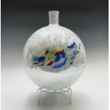 A contemporary multicoloured art glass vase of globular form, with stand. Height 43.5cm overall.