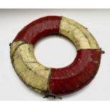 A vintage cork filled lifebuoy, with painted canvas cover, diameter 56cm.