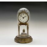 A brass cased 400 day torsion clock, the dial signed Urania, the movement stamped number 56221, with