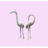 A pair of cast metal flamingo garden ornaments. The tallest 85cm high.