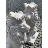 A pair of cast concrete garden ornaments, seated lions with crowns. Height 35cm.