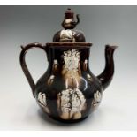 A Victorian Measham treacle glazed bargeware large teapot, dated 1882, the domed cover with teapot