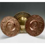 A pair of Arts and Crafts style copper plaques, each repousse decorated with two birds to the centre